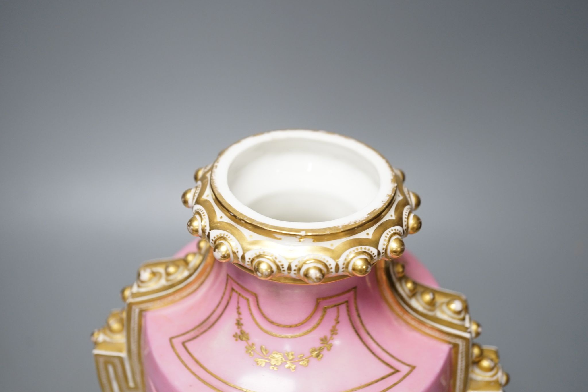 A Coalport two handled vase and cover painted with a Watteauesque scene to one side and a panel of fruit and flowers by William Cook 31cm